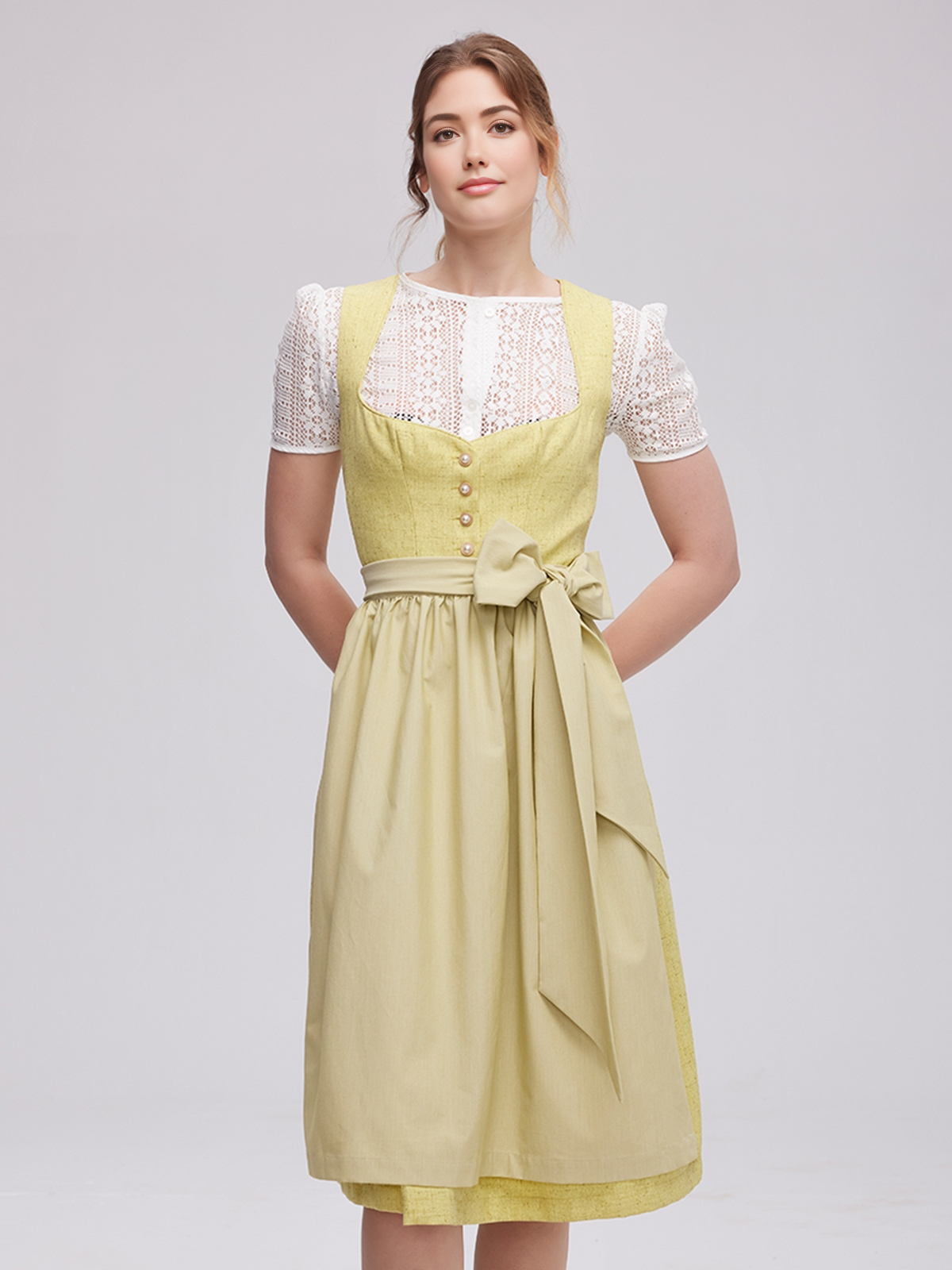 Ein strahlendes gelbes Dirndl mit floralen Details, das perfekt für Sommerfeste und Hochzeiten geeignet ist
