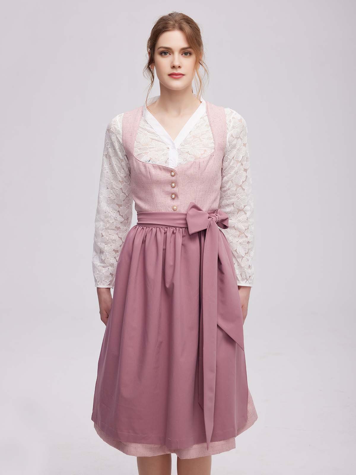 Dirndl in Rosa mit traditioneller Schürze